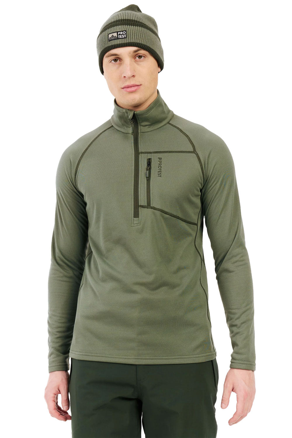 Man wearing a green pullover with a zipper and matching beanie on a white background