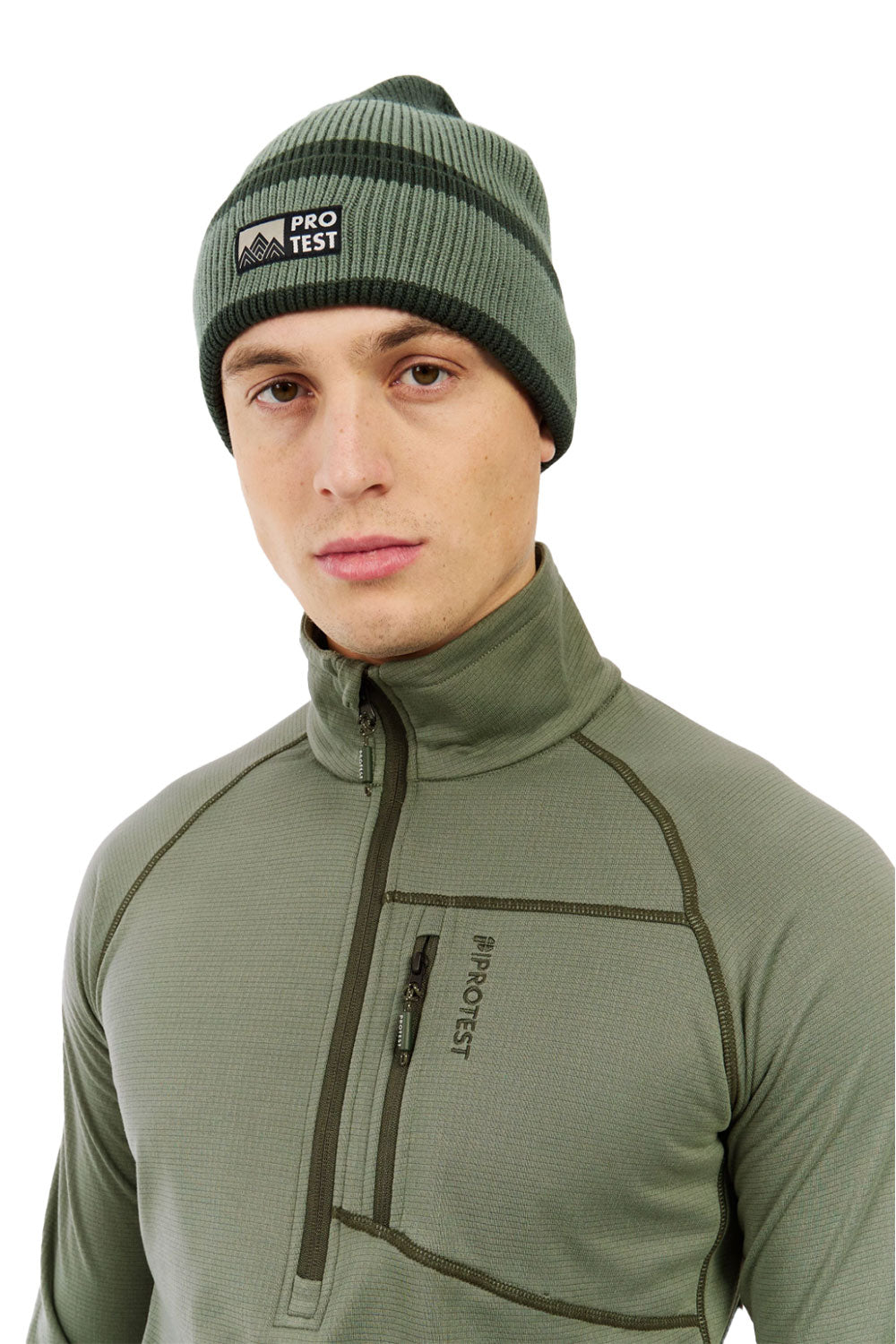 Man wearing a green beanie and jacket with 'Protest' branding on a white background