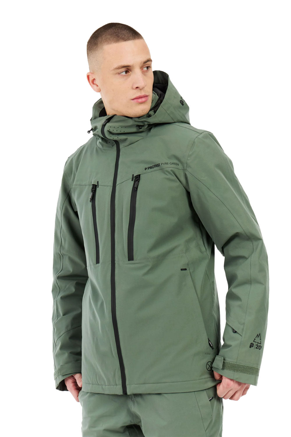Person wearing a green jacket with black zippers on a white background