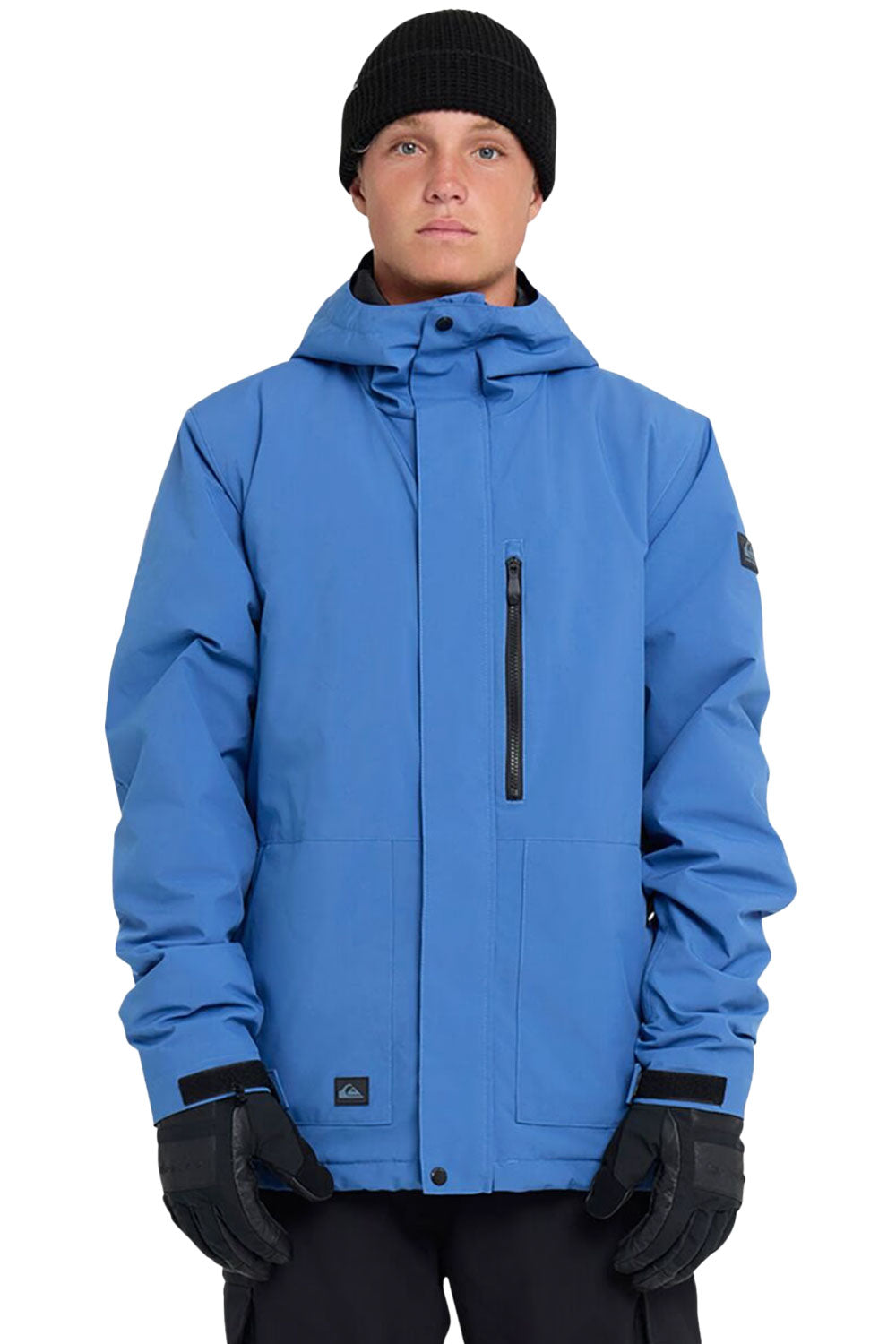 Person wearing a blue jacket with black accents on a white background