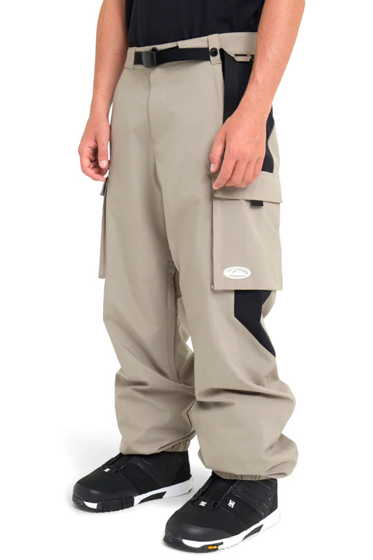 Beige cargo pants with black accents worn by a person on a white background