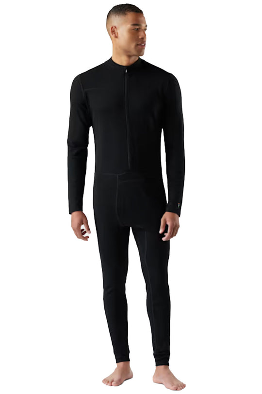 Person wearing a black one piece base layer on a white background