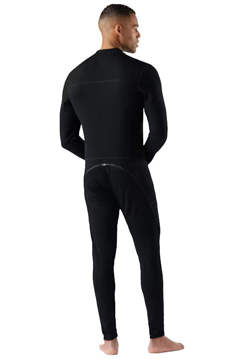 Person wearing a black one piece base layer on a white background