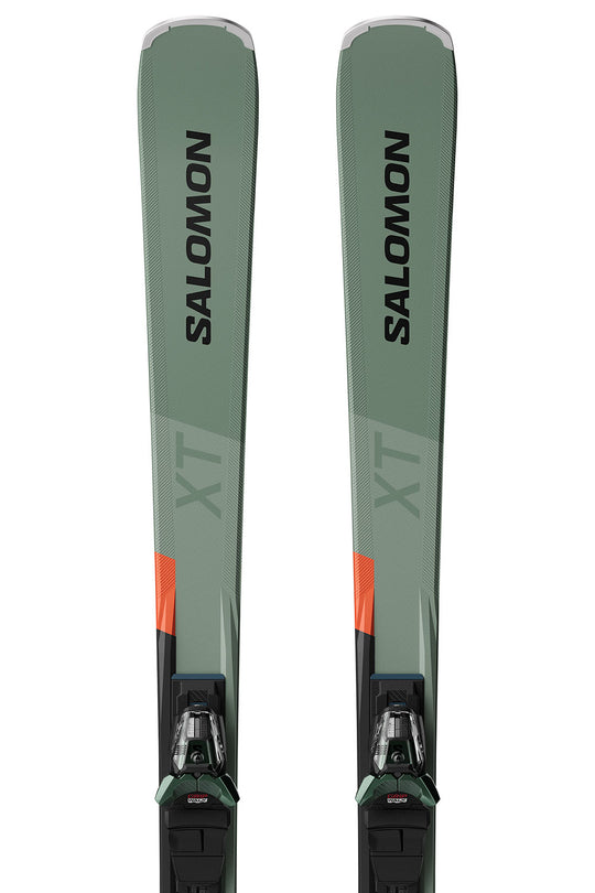 Pair of Salomon skis with green and black design on a white background