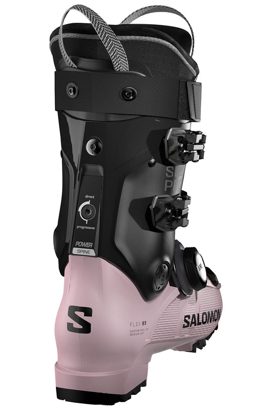 Salomon ski boot with black and pink design on a white background