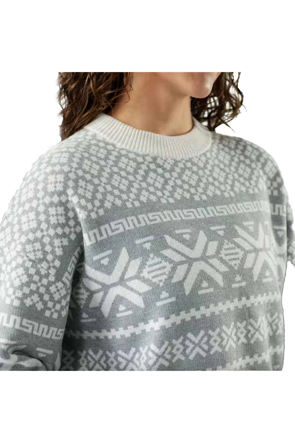 woman wearing a grey and white snowflake pattern sweater