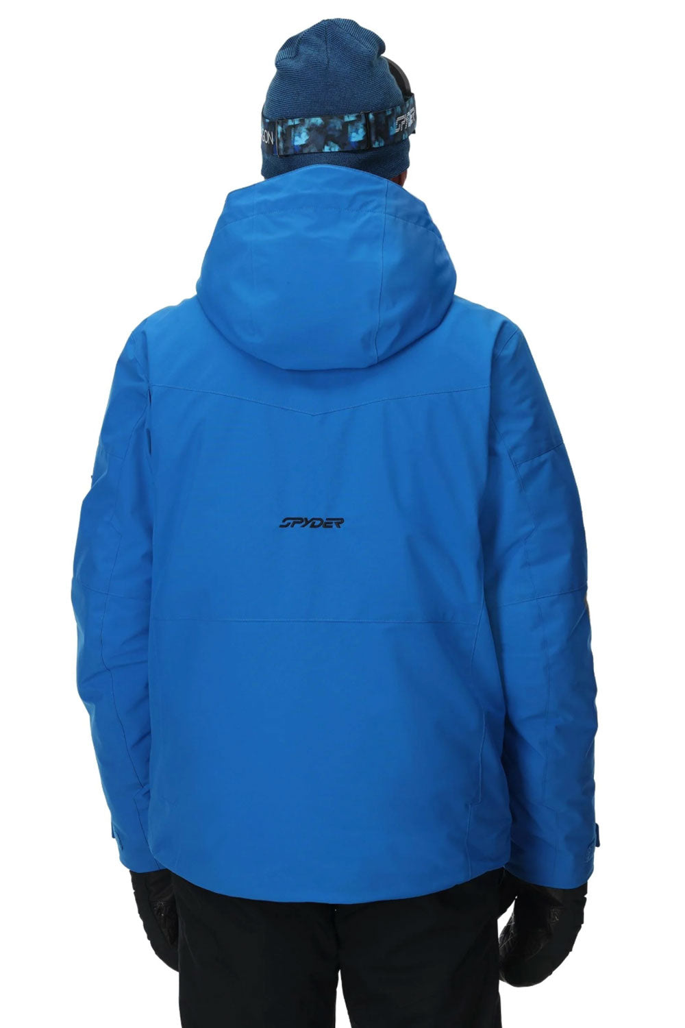 Blue jacket with a brand logo on the back, worn by a person against a white background