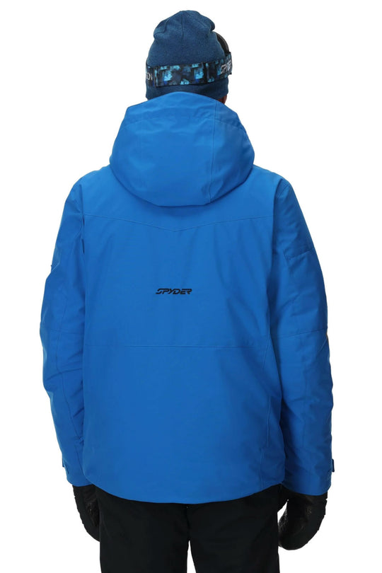 Blue jacket with a brand logo on the back, worn by a person against a white background