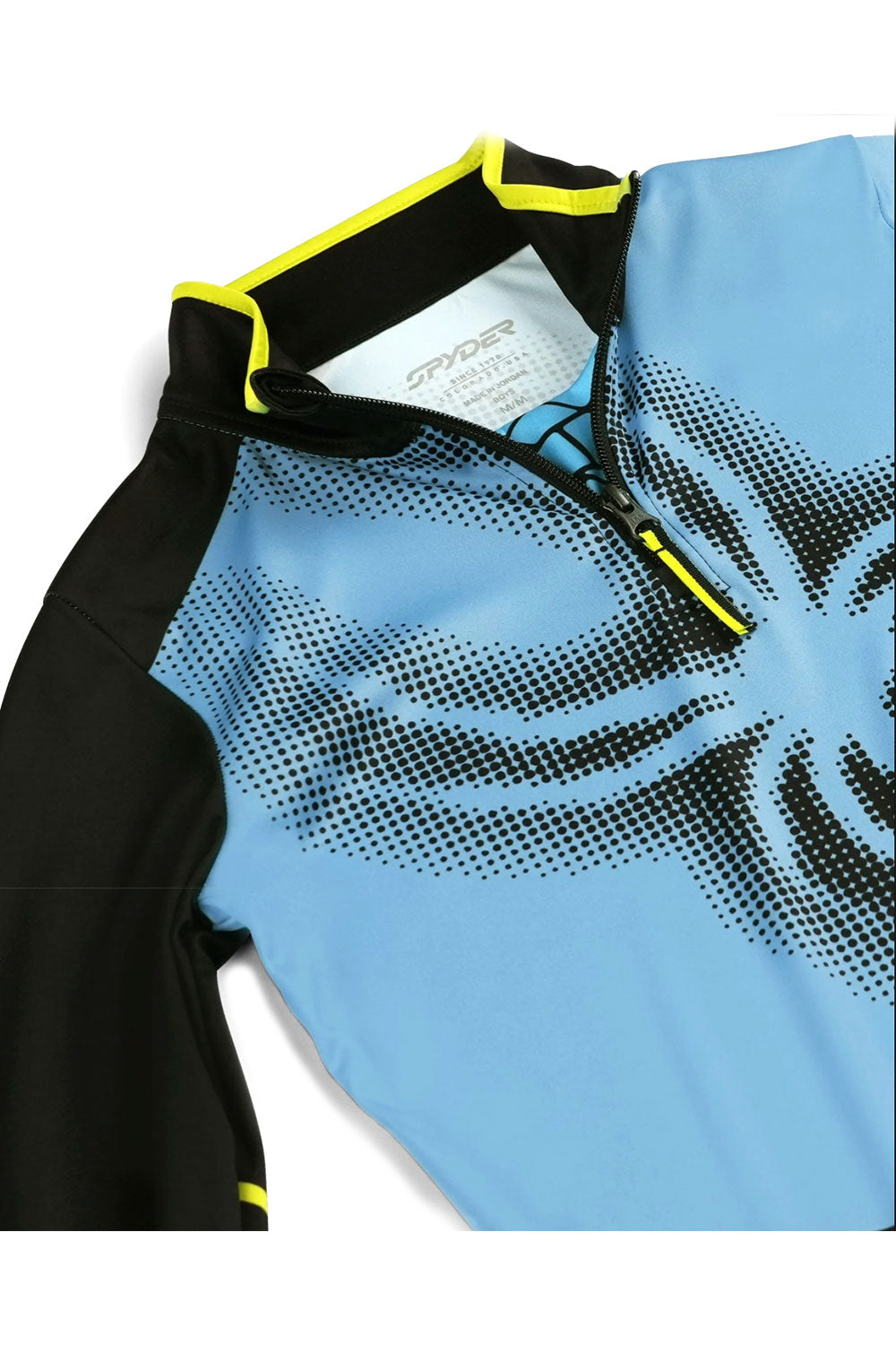 Blue and black midlayer top with a spider web design on a white background