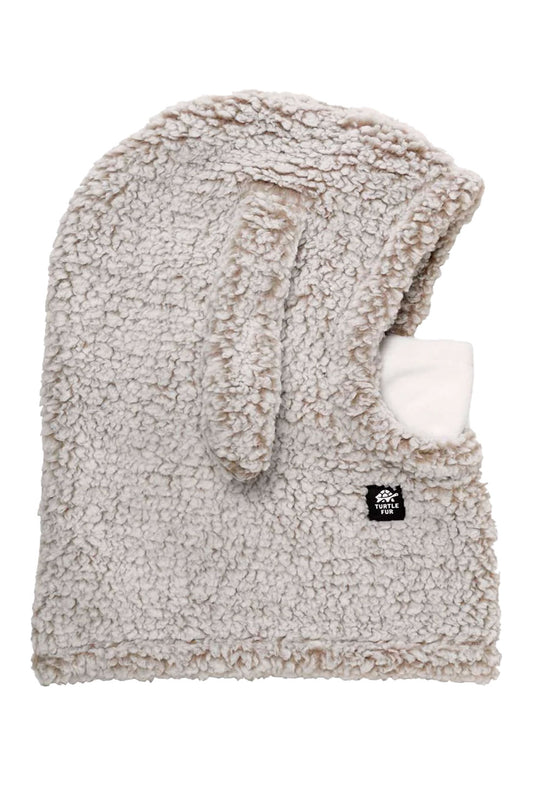 Fuzzy beige hood with a white interior on a white background