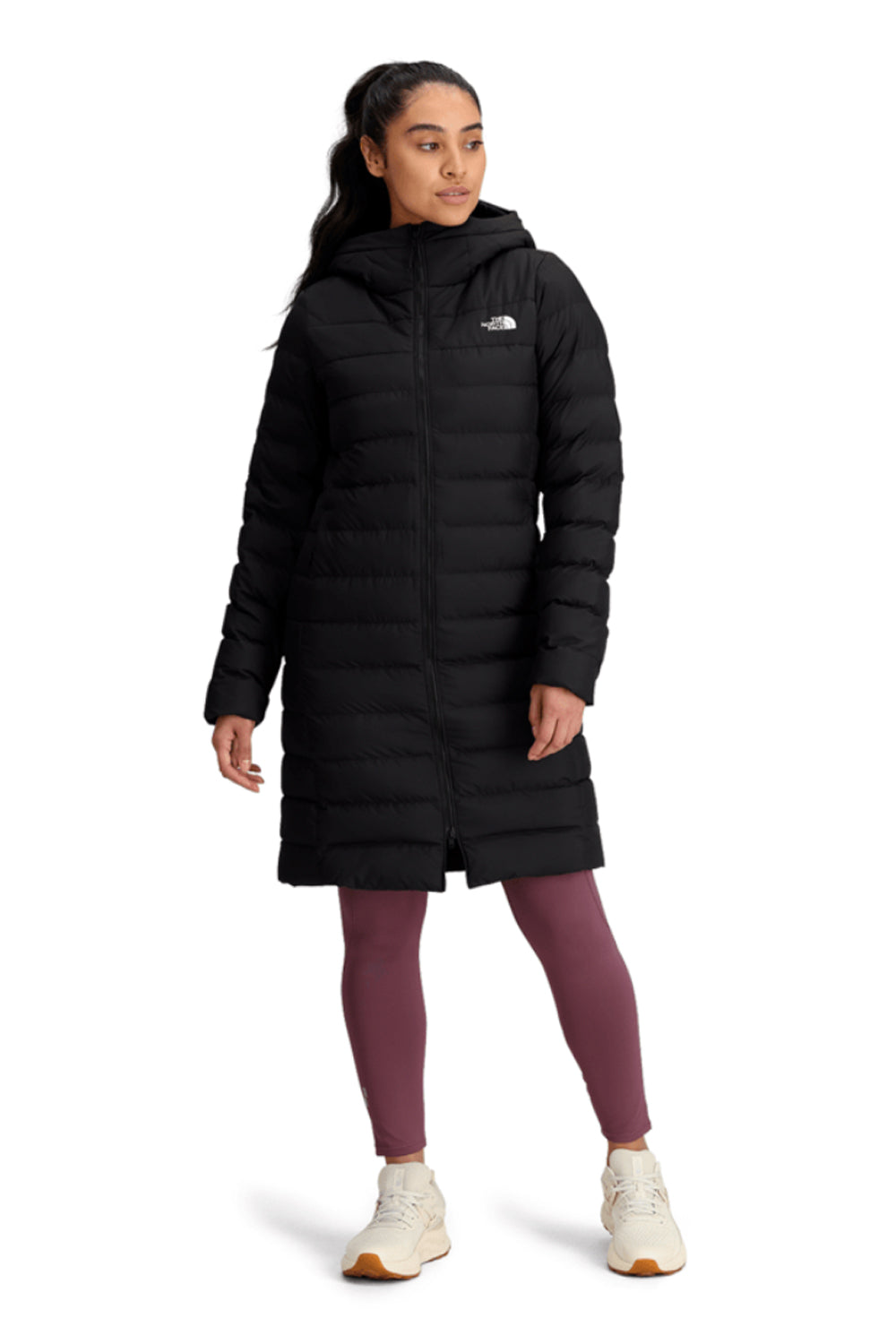 Person wearing a black coat on a white background