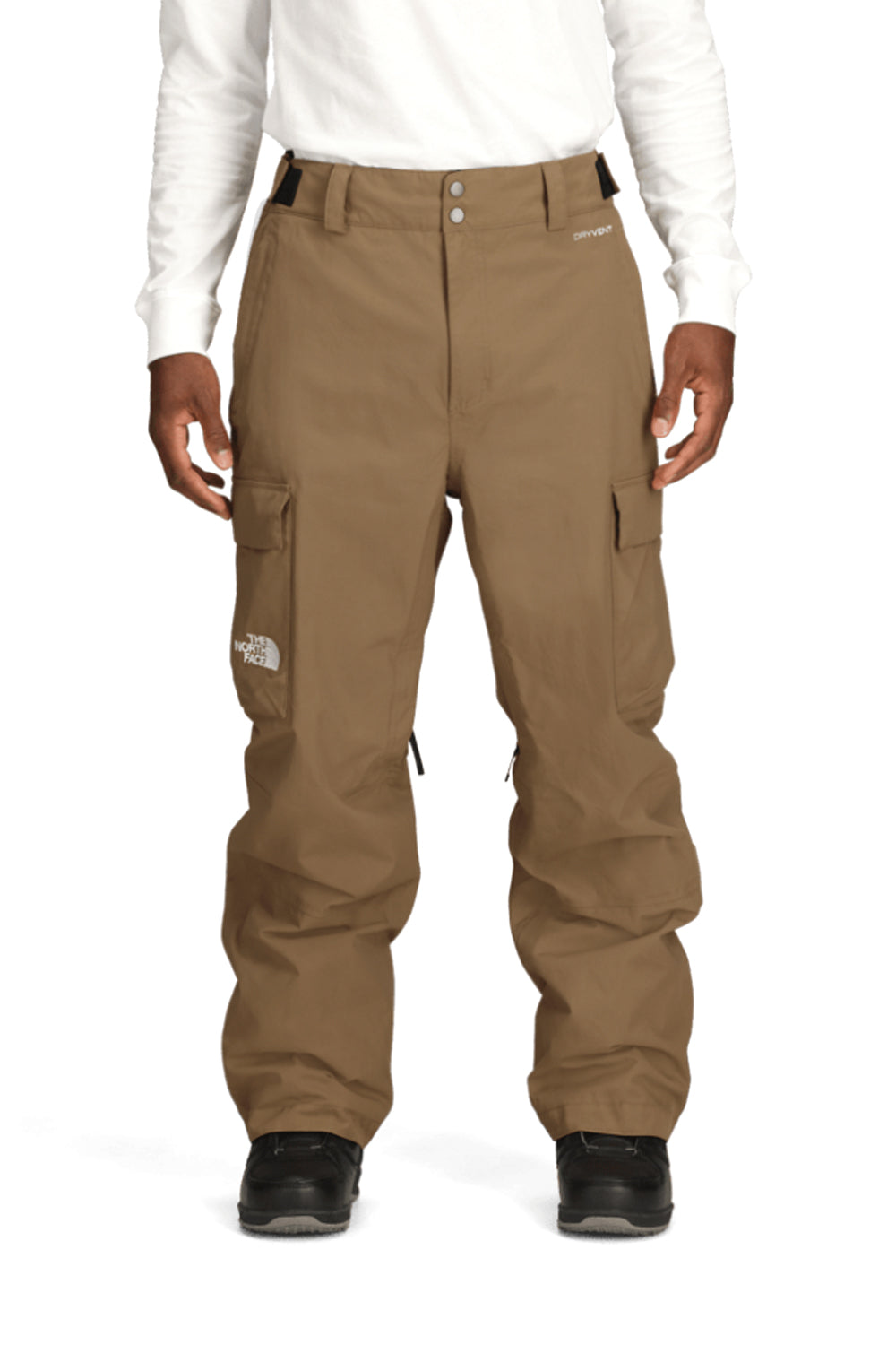 Brown cargo snow pants worn by a person on a white background