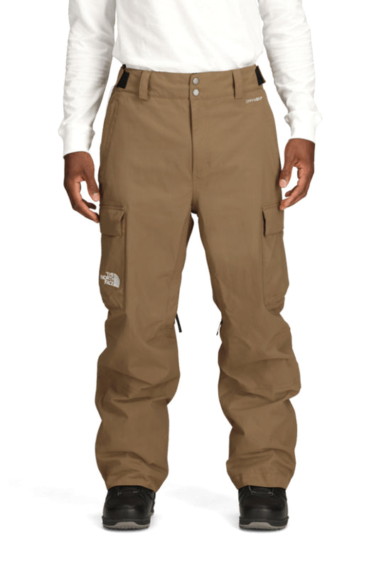 Brown cargo snow pants worn by a person on a white background