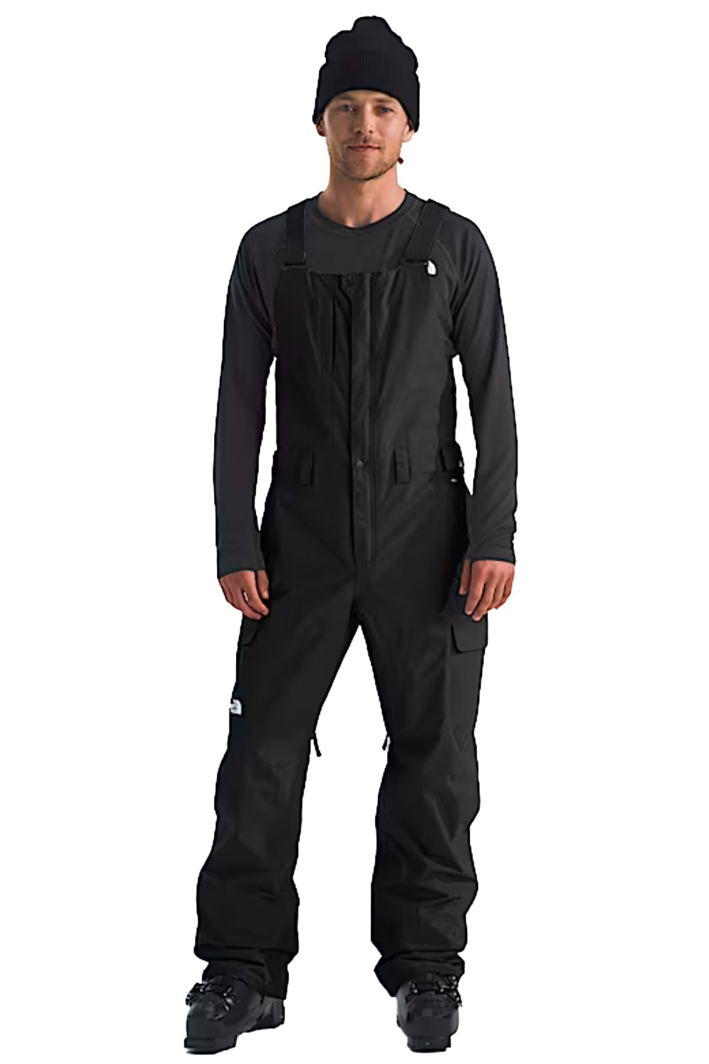 Person wearing a black ski/snowboard bib pants
