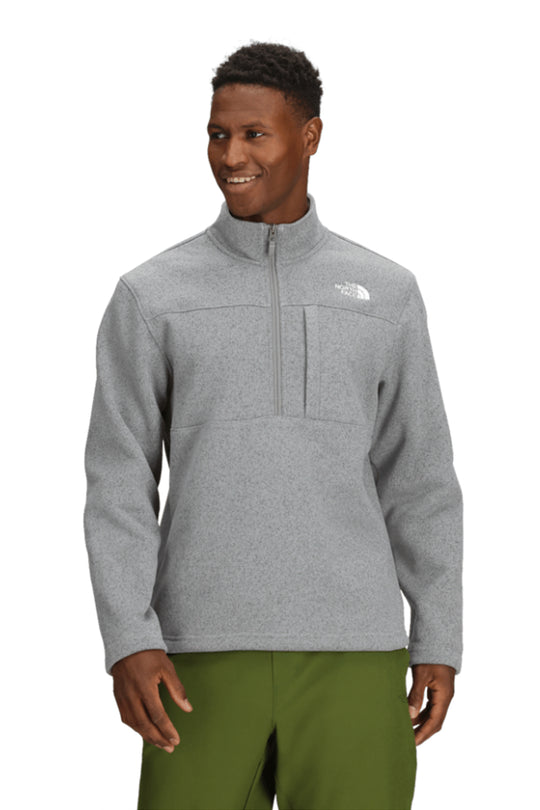 Man wearing a gray fleece pullover with a brand logo on a white background