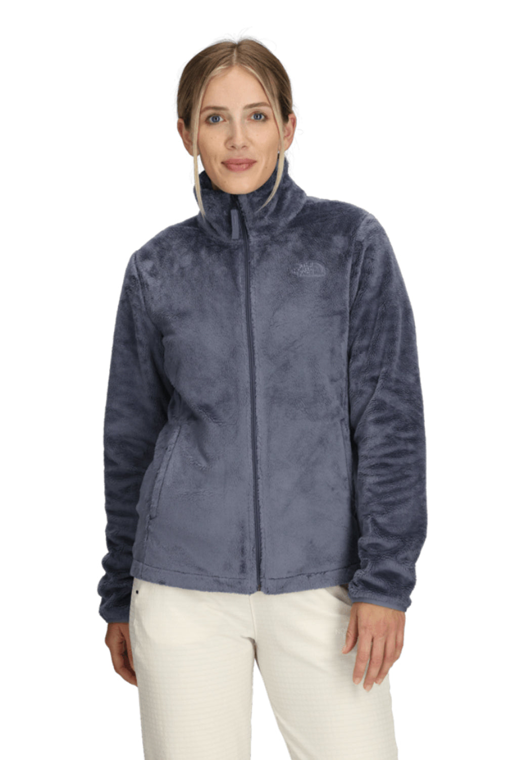 Woman wearing a blue fleece jacket on a white background