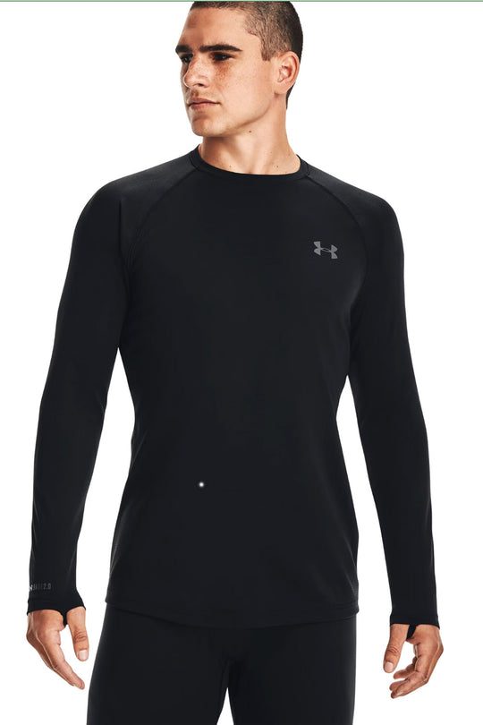 Person wearing a black long-sleeve athletic shirt with Under Armour logo on a white background