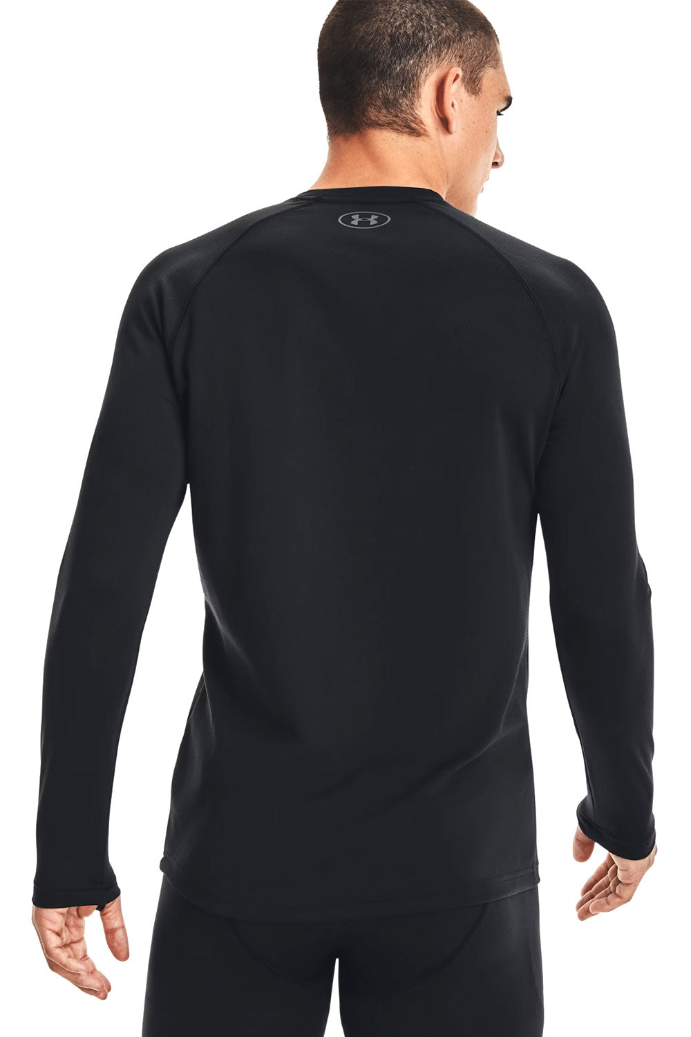Man wearing a black long-sleeve shirt with a brand logo on the back, on a white background