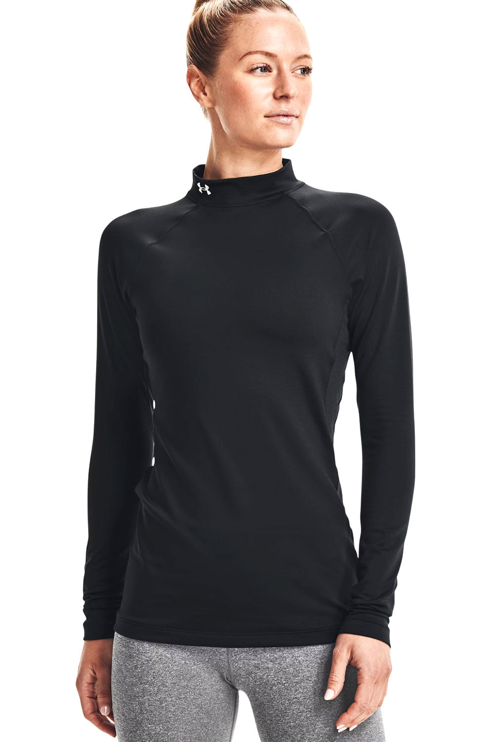 Woman wearing a black long-sleeve athletic top on a white background