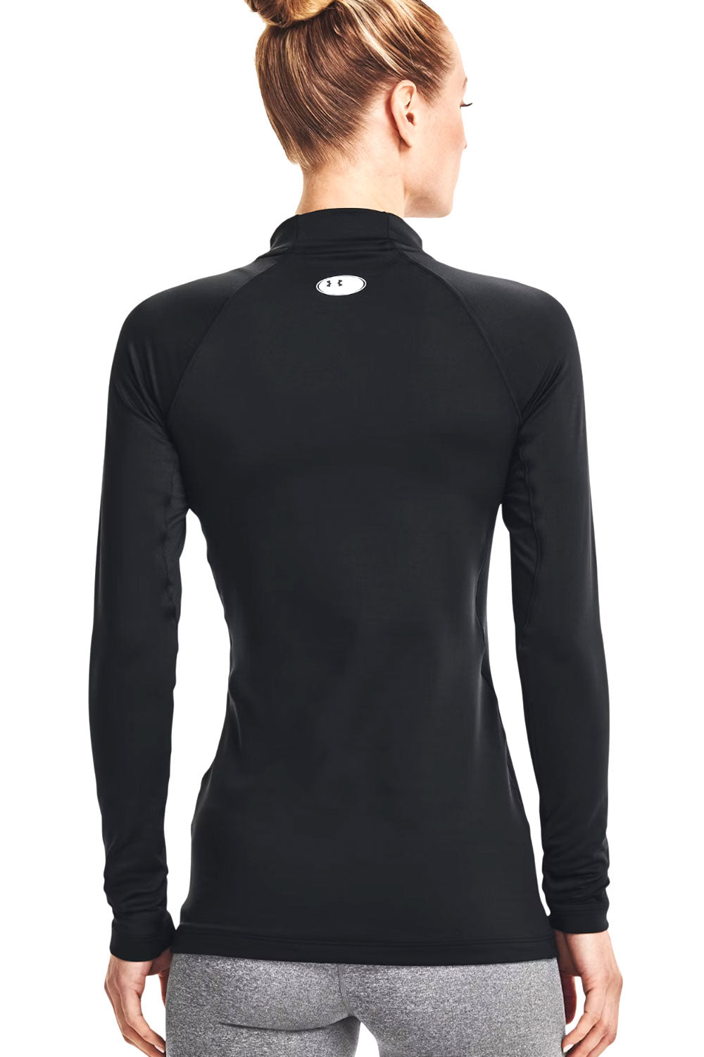 Black long-sleeve athletic top with a brand logo on the back, worn by a person.