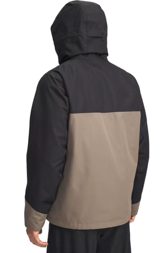 Two-tone jacket with black and beige sections on a white background