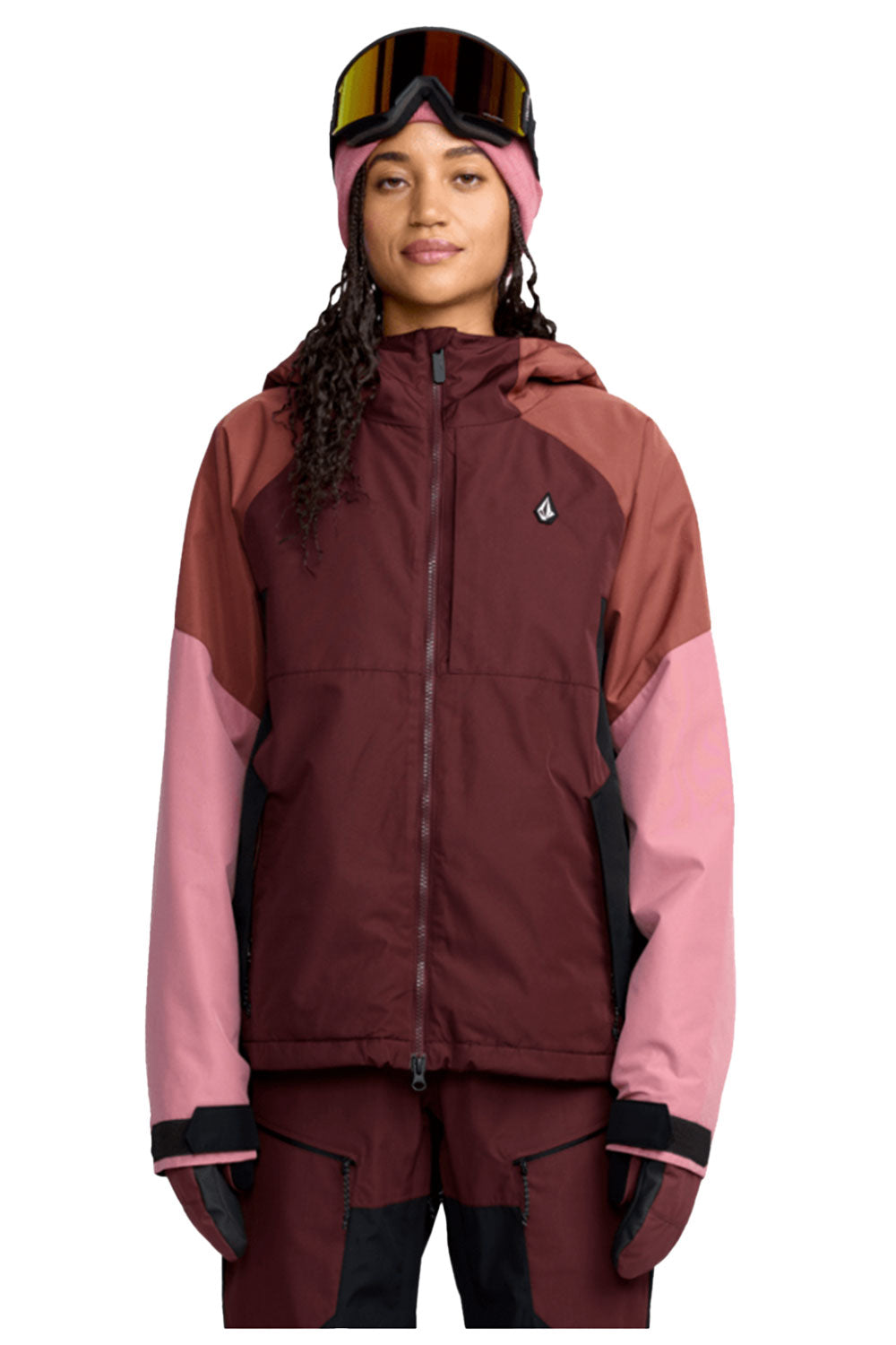 Person wearing a maroon and pink jacket with a brand logo on a white background
