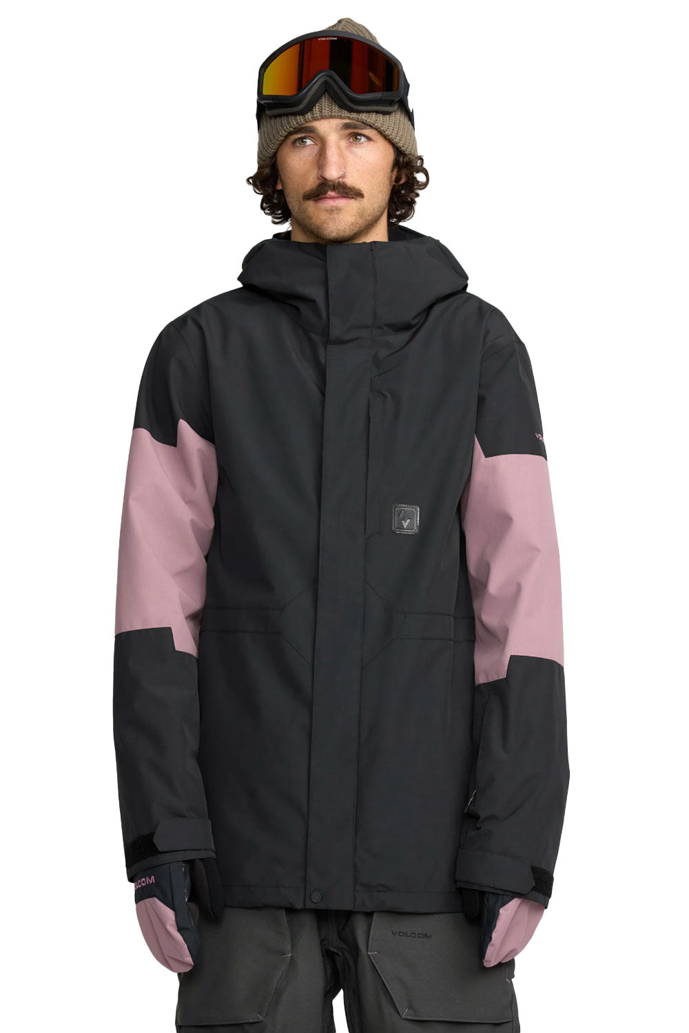 Person wearing a black and pink jacket with goggles on a white background