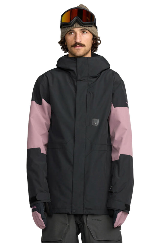 Person wearing a black and pink jacket with goggles on a white background