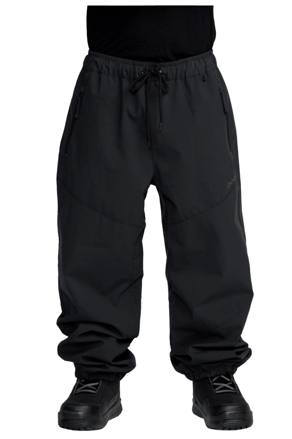 Black pants worn by a person on a white background