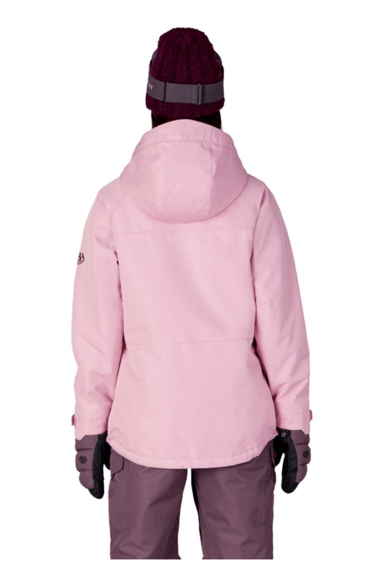 Person wearing a pink winter jacket and purple pants on a white background
