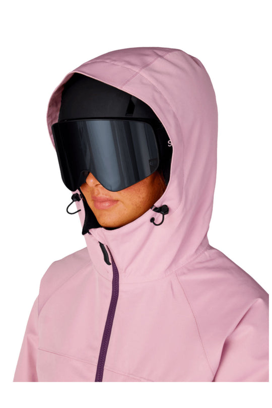 Person wearing a pink hooded jacket with a black visor on a white background