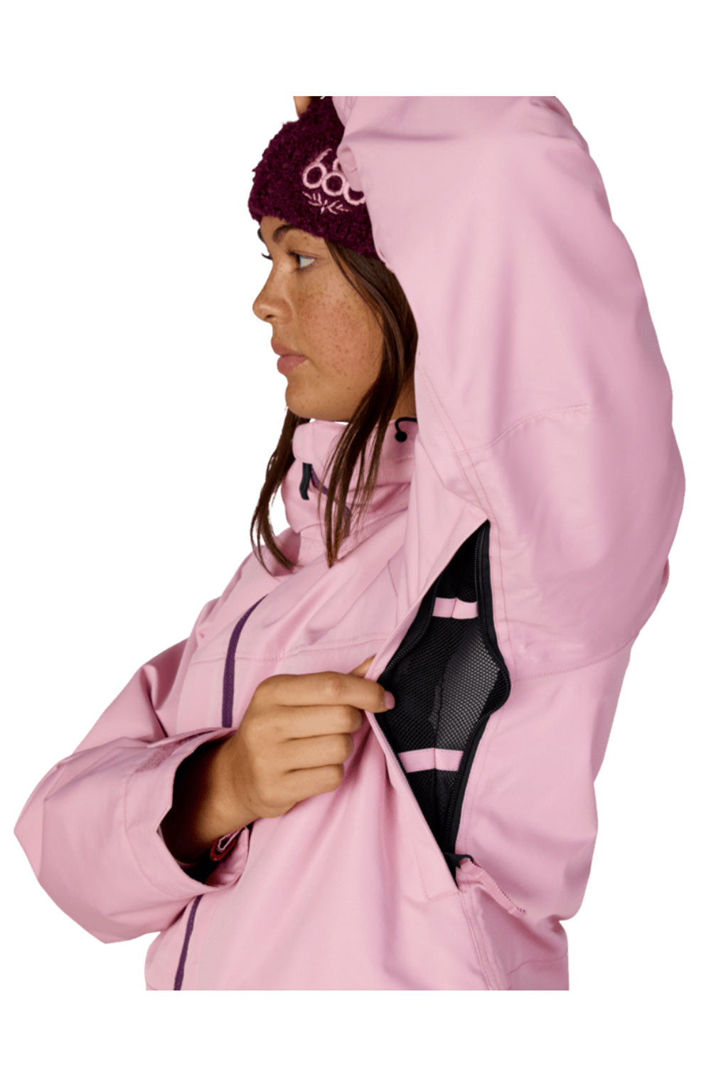 Person wearing a pink jacket with a hood on a white background
