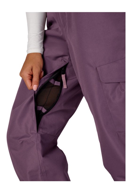 Purple pants with a hand adjusting the waistband on a white background