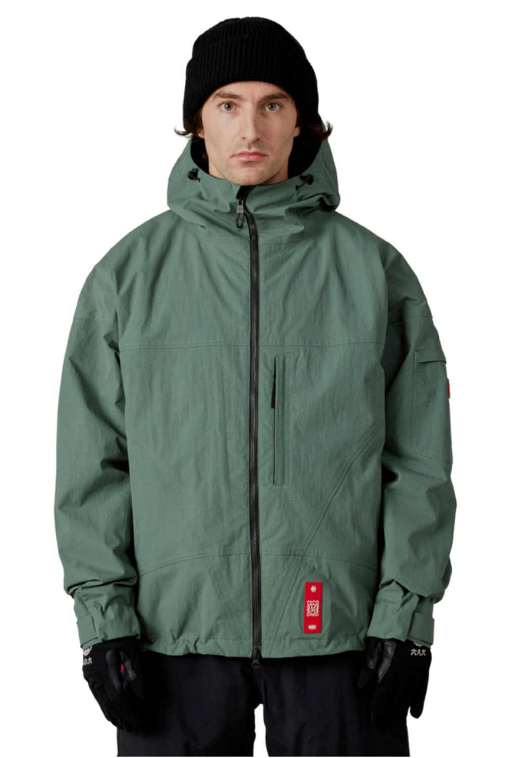 Person wearing a green jacket with a hood on a white background