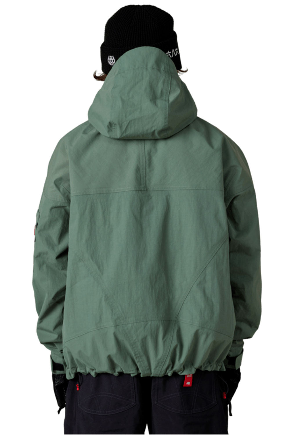 Green jacket worn by a person on a white background