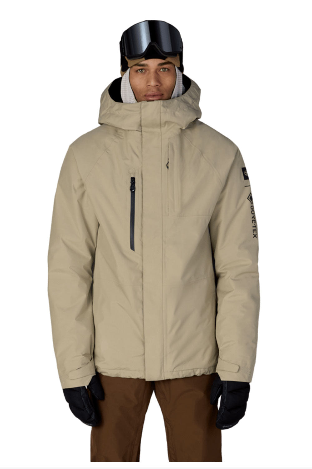 Person wearing a beige snow jacket with a hood, goggles, and gloves on a white background