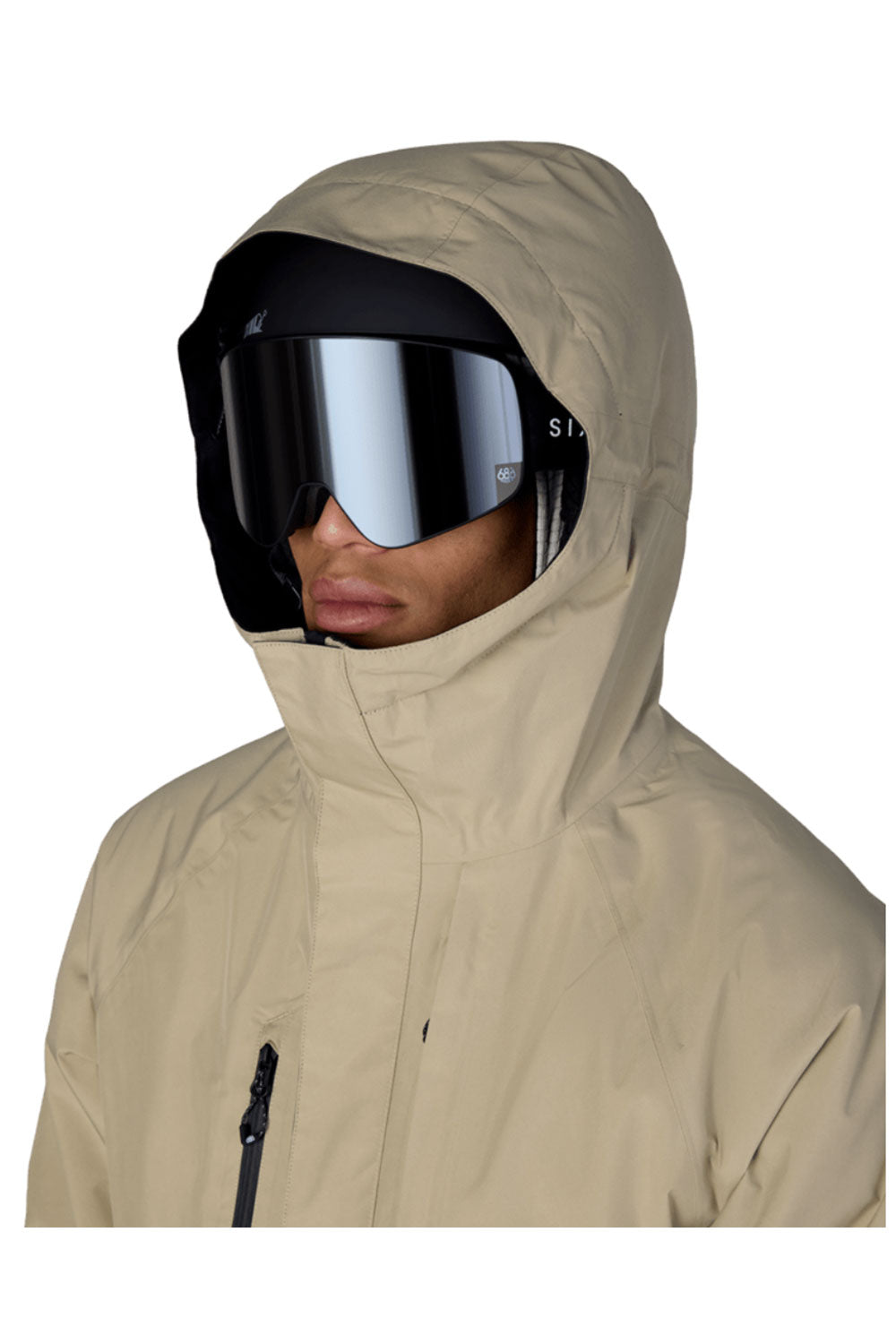 Person wearing a beige hooded jacket and reflective goggles on a white background