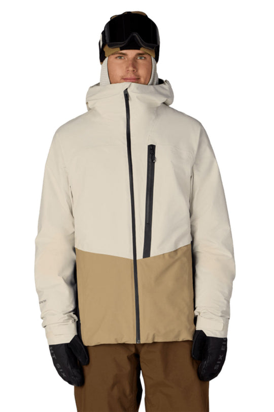 Person wearing a two-tone jacket with beige and white sections on a white background