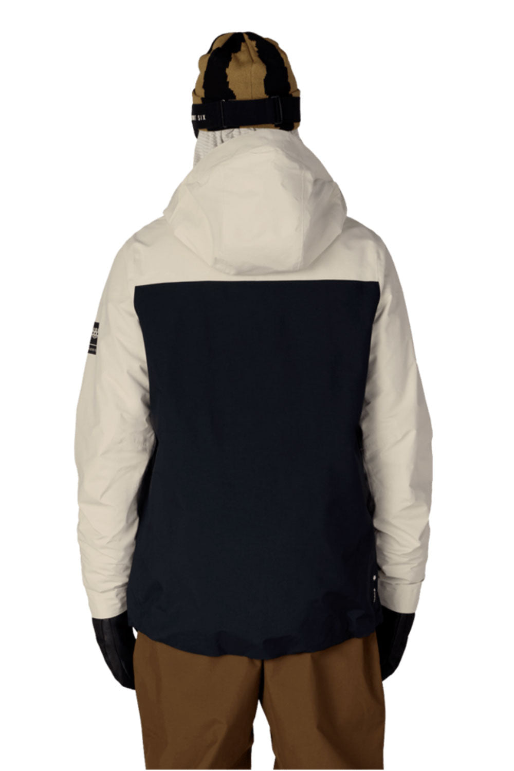 Person wearing a white and black jacket with a hood on a white background