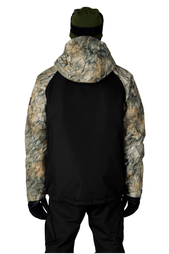 Person wearing a black jacket with camouflage hood and sleeves on a white background