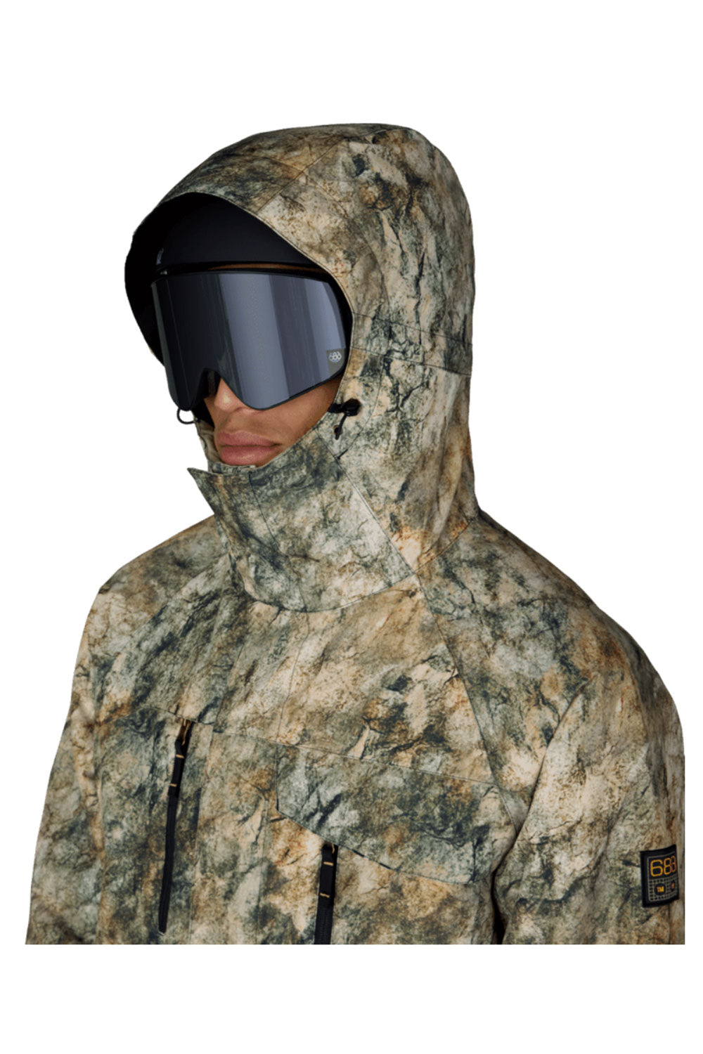 Person wearing a camouflage hooded jacket with a helmet and goggles on a white background