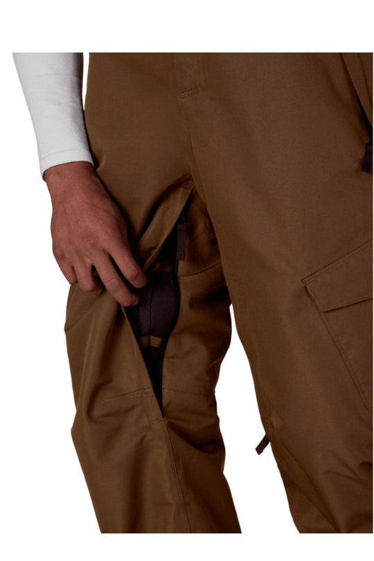 Brown pants with a hand adjusting the waistband on a white background