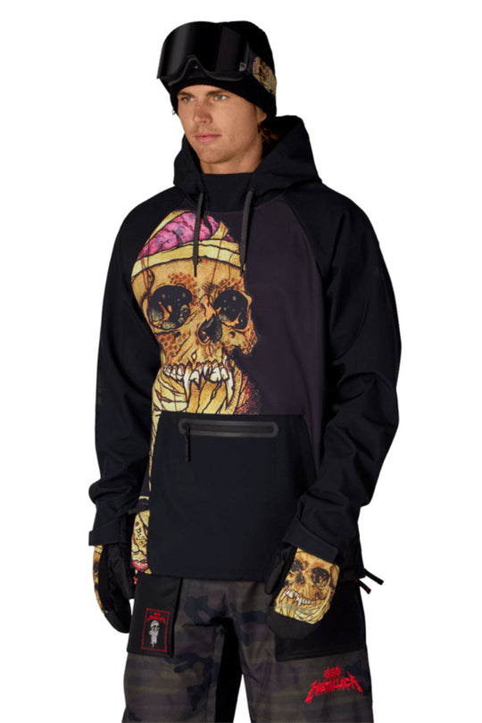 Person wearing a black hoodie with a skull design and camouflage pants on a white background