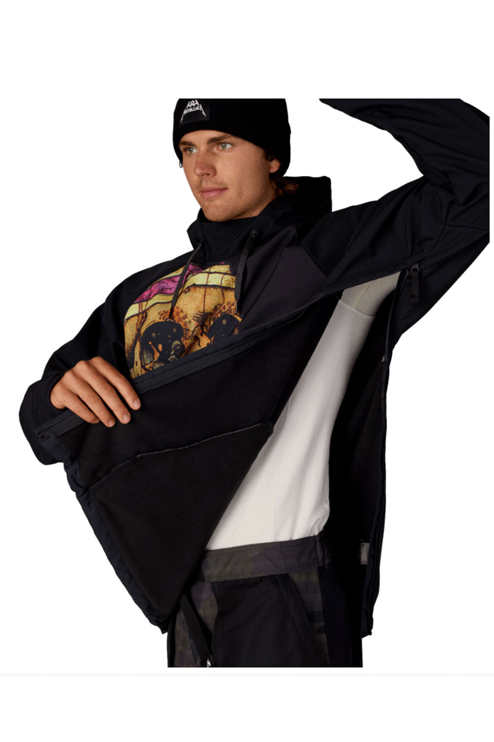Person wearing a black jacket with a colorful graphic on a white background