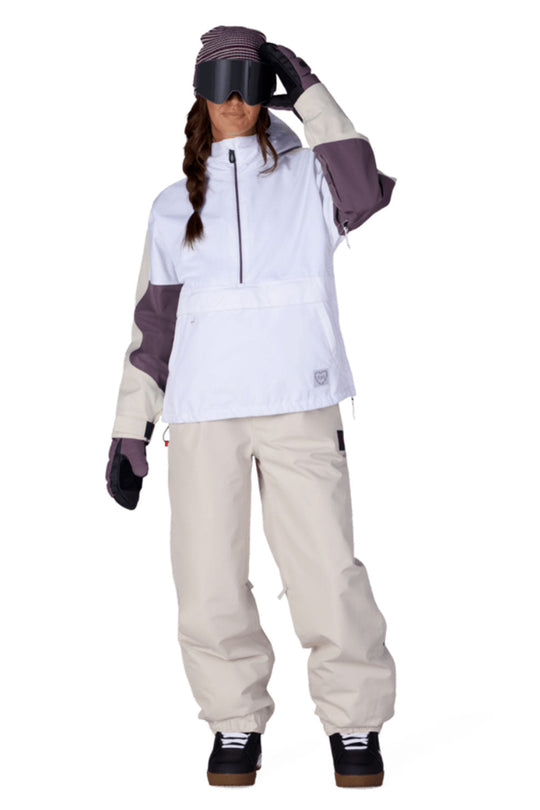 Person wearing a white and beige snowboarding outfit with purple accents on a white background