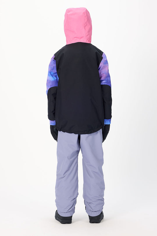 A child shown from the back wearing a hooded jacket with a bright pink hood, black body, and purple-to-blue gradient sleeves, paired with light lavender snow pants, against a plain white studio background.