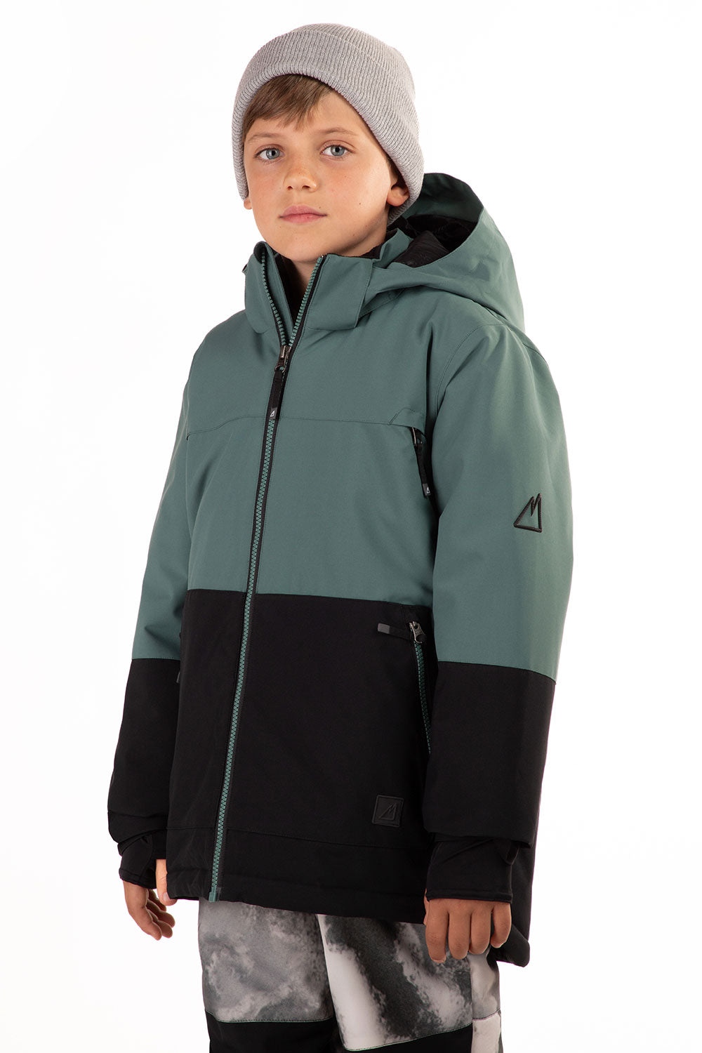 Child wearing a green and black jacket on a white background