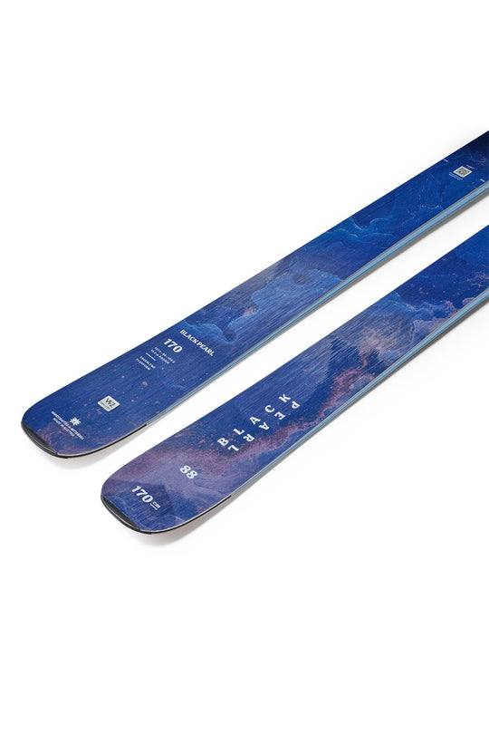 Blue skis with a wavy pattern on a white background