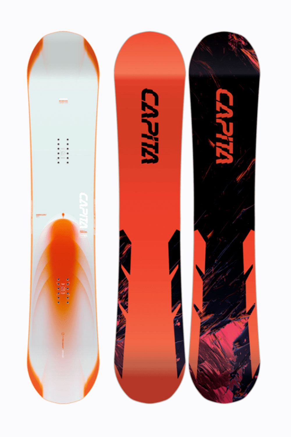 Three CAPiTA snowboards with different designs on a white background