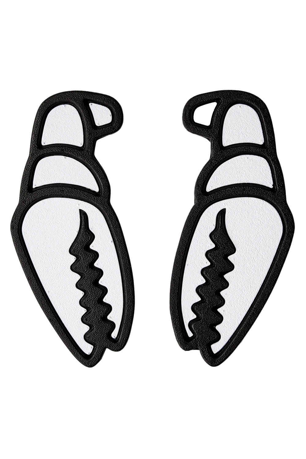 A pair of black and white claw-shaped stomp pads on a plain white background.